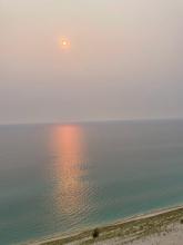 A scenic picture of Lake Michigan at sunset from the Sleeping Bear Dunes from my 2023 summer trip with the author's friends, while taking summer classes at Michigan! 