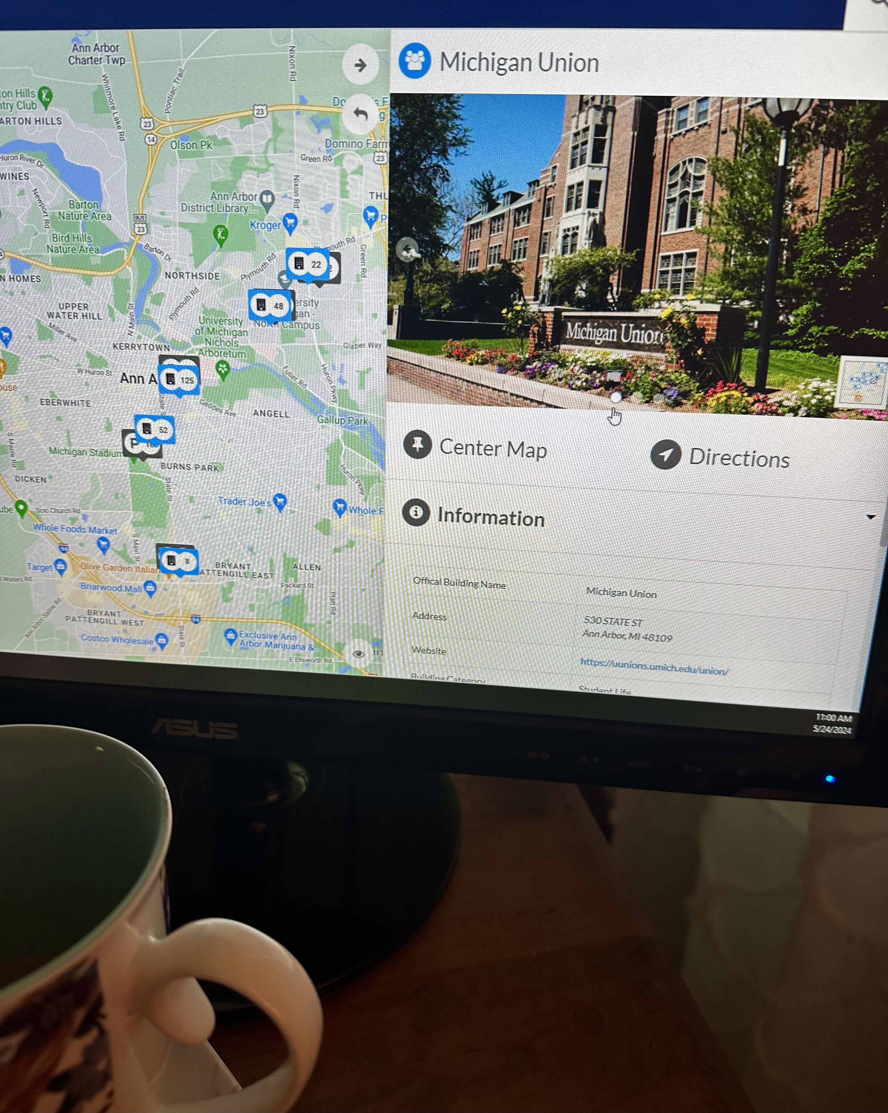 View of computer screen viewing Campus Maps at Michigan Union, with coffee cup in foreground.
