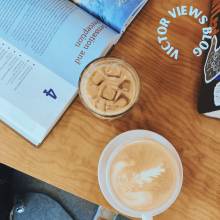Picture of two lattes and a Psychology textbook