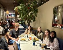 Taking a break, five ResNavs sit in Sava's with their food orders just delivered to the table (L - R: Ronen, Pearl, Kathryn, Nicole, Pranavi).