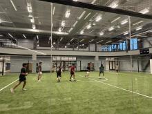 Students playing soccer on a new Hadley indoor field.