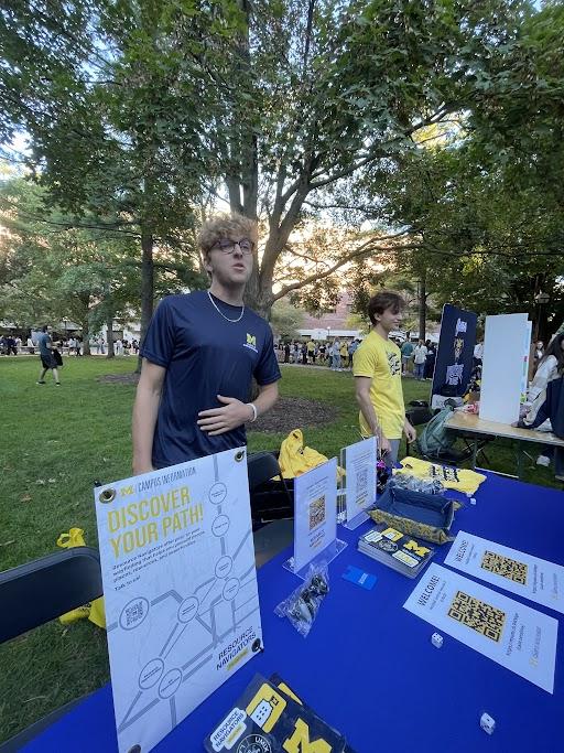 Male student tabling on Diag at Festifall.