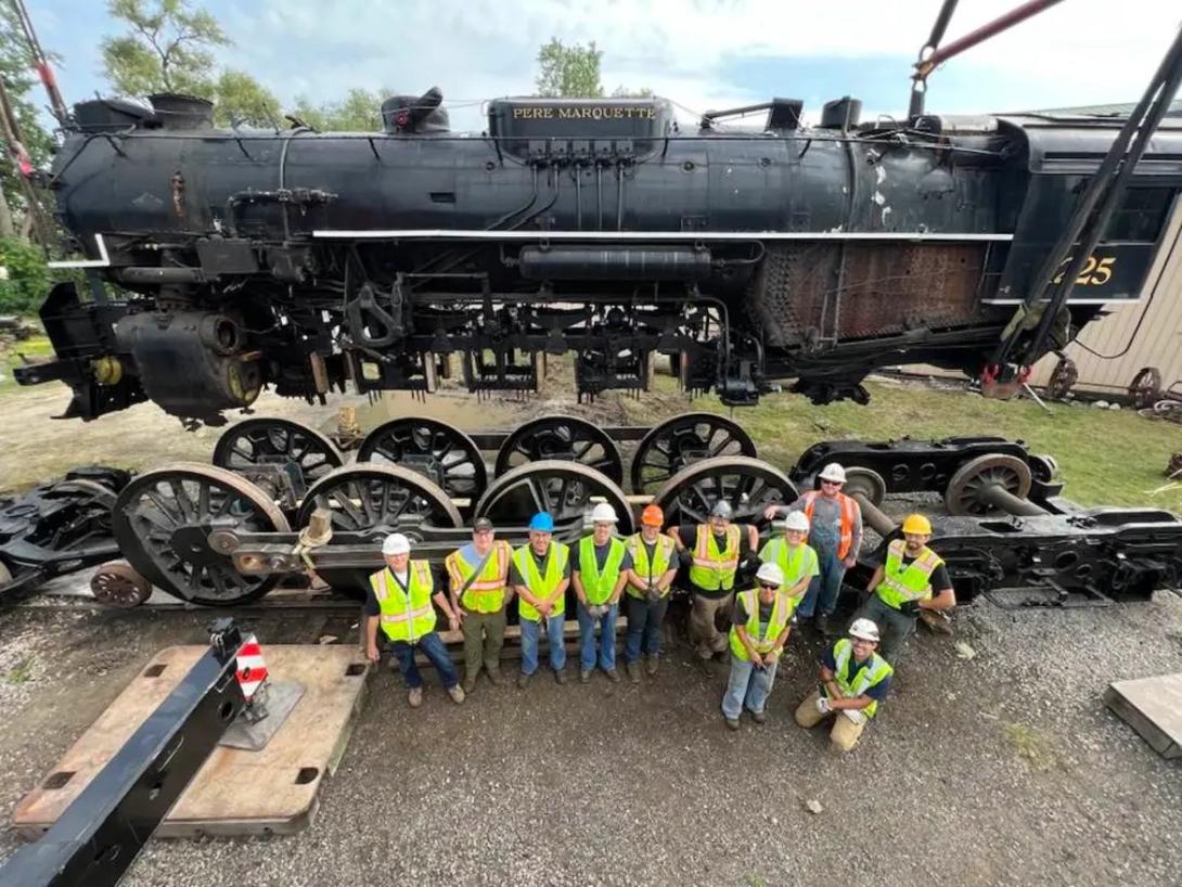 Anya's photo of employees in front of an engine at the Steam Railroading Institute, where she worked as an engineering undergraduate, which she shares as part of "building relationships."